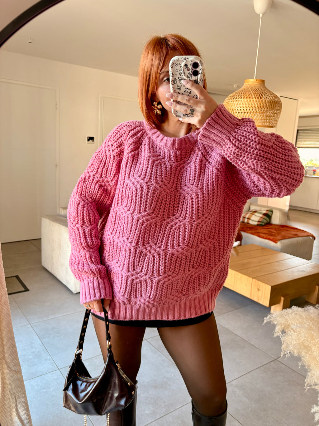 Pull en maille torsadée rose