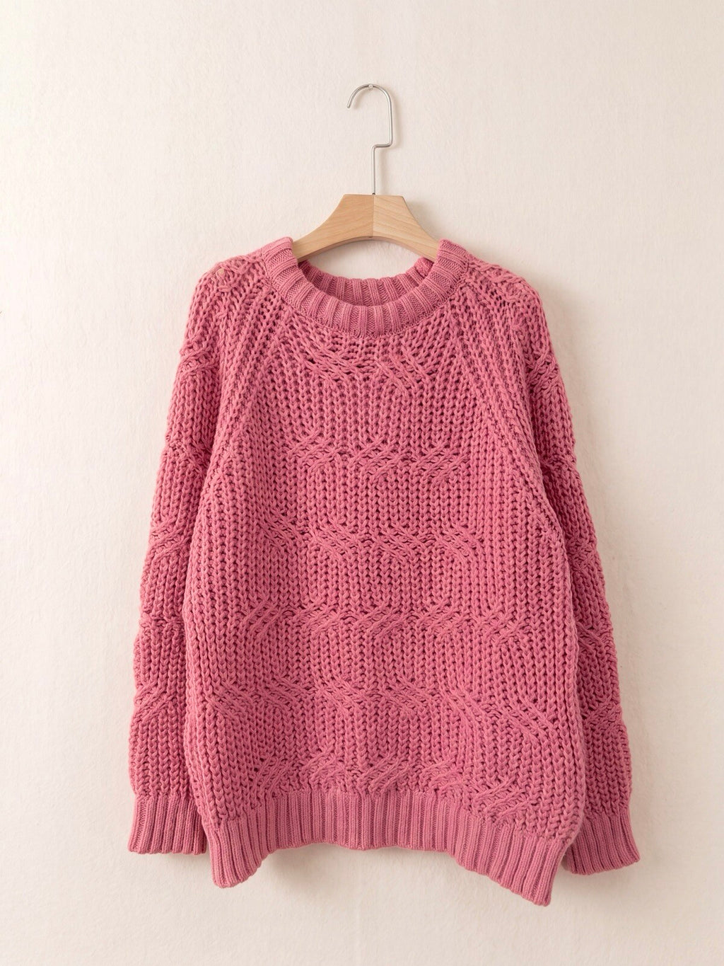 Pull en maille torsadée rose